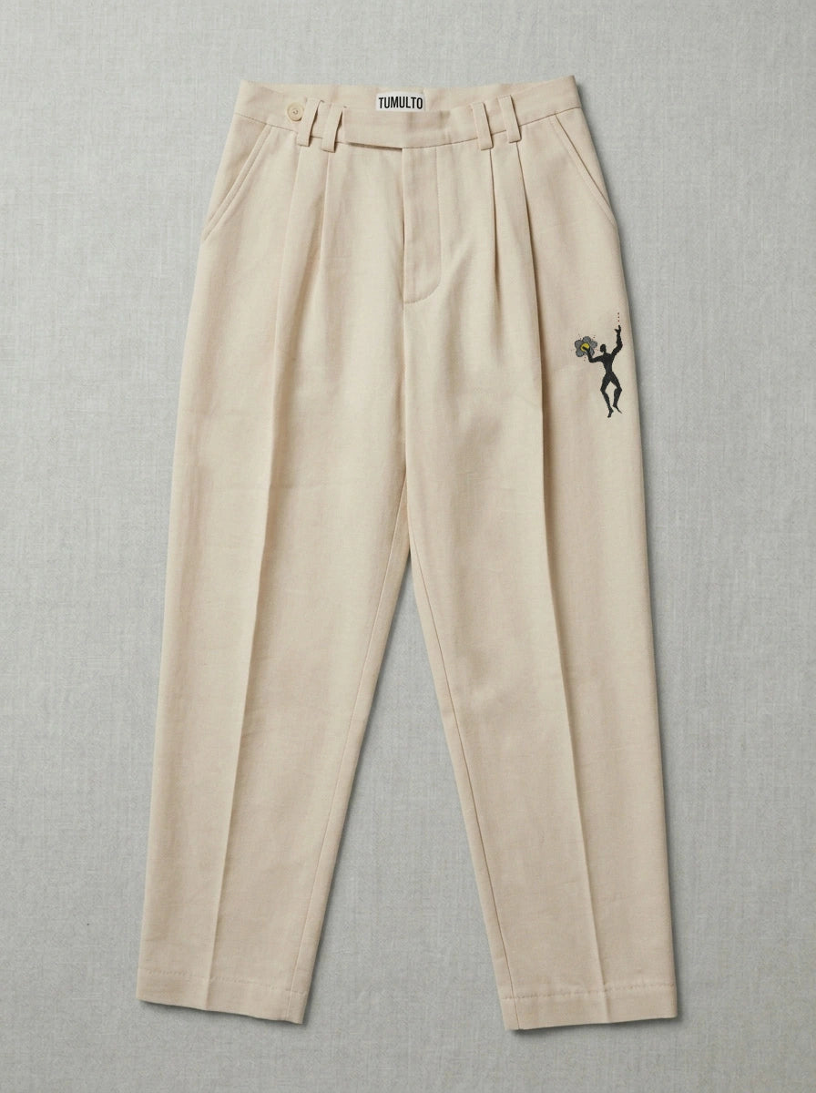 Handmade flower trousers with textured fabric by Tumulto sustainable fashion brand