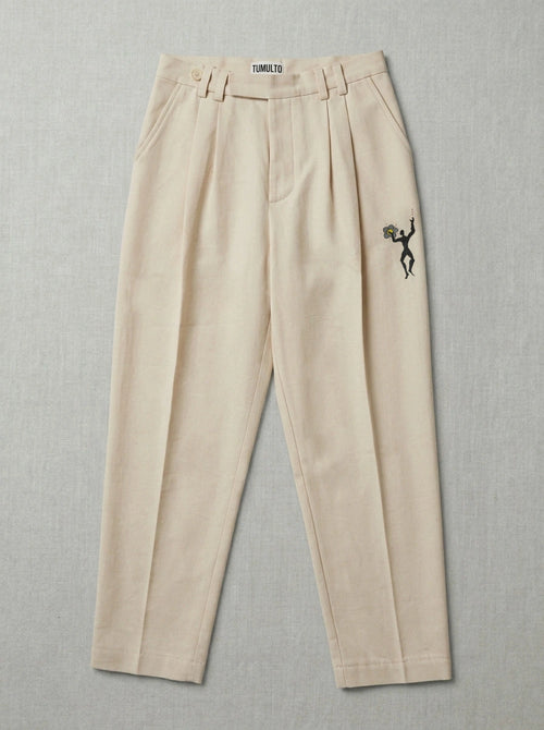Handmade flower trousers with textured fabric by Tumulto sustainable fashion brand