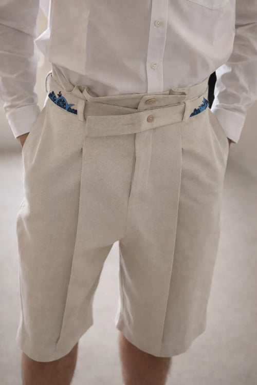 Model wearing artisanal Hills shorts with organic textured fabric in slow fashion design by Tumulto