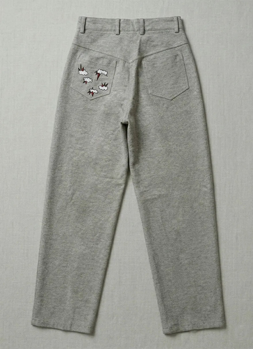 Model wearing Icarus trousers showcasing sustainable artisanal menswear by Tumulto fashion brand