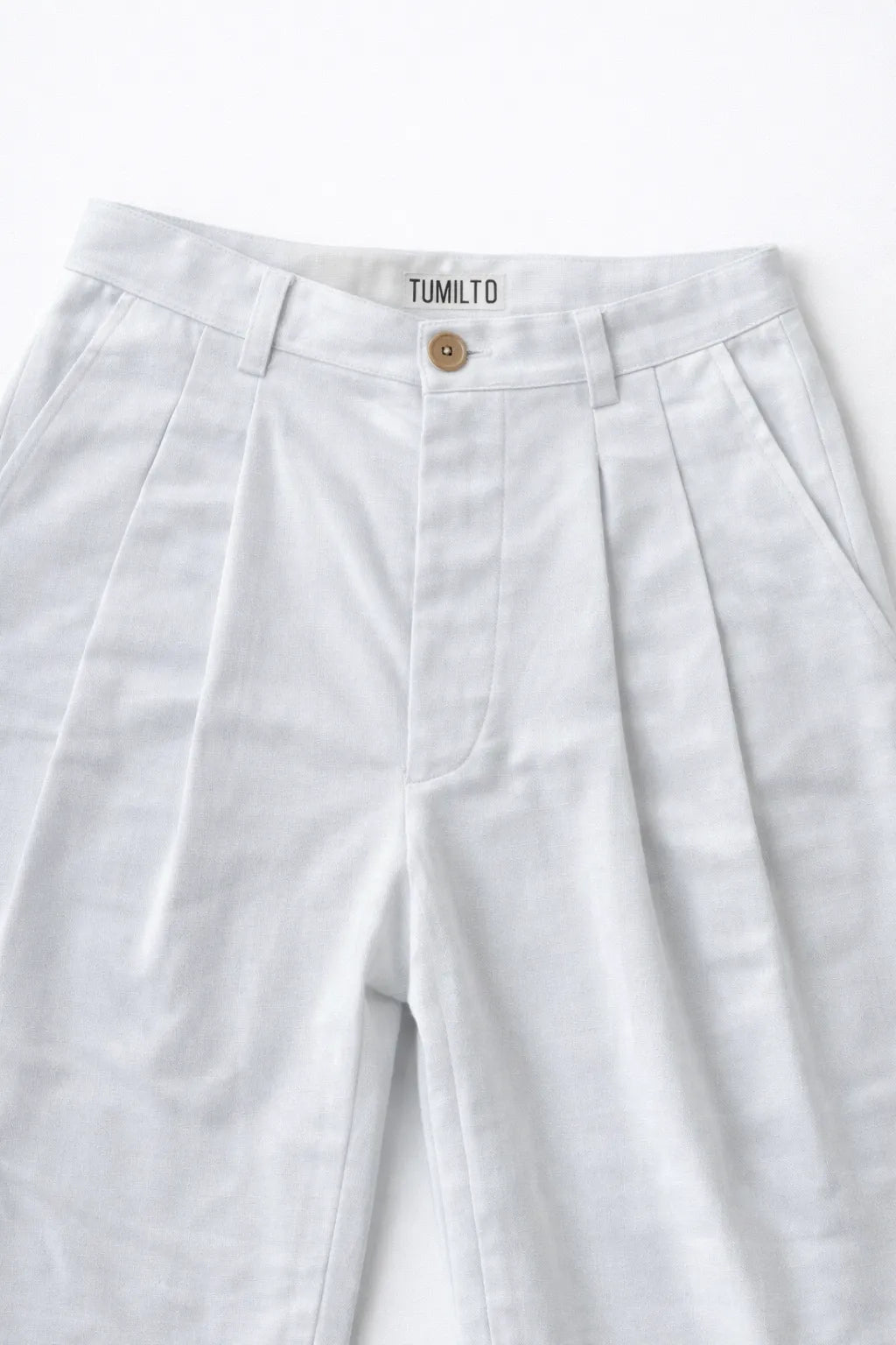Close-up of textured fabric jungle trousers handcrafted eco-friendly menswear Tumulto