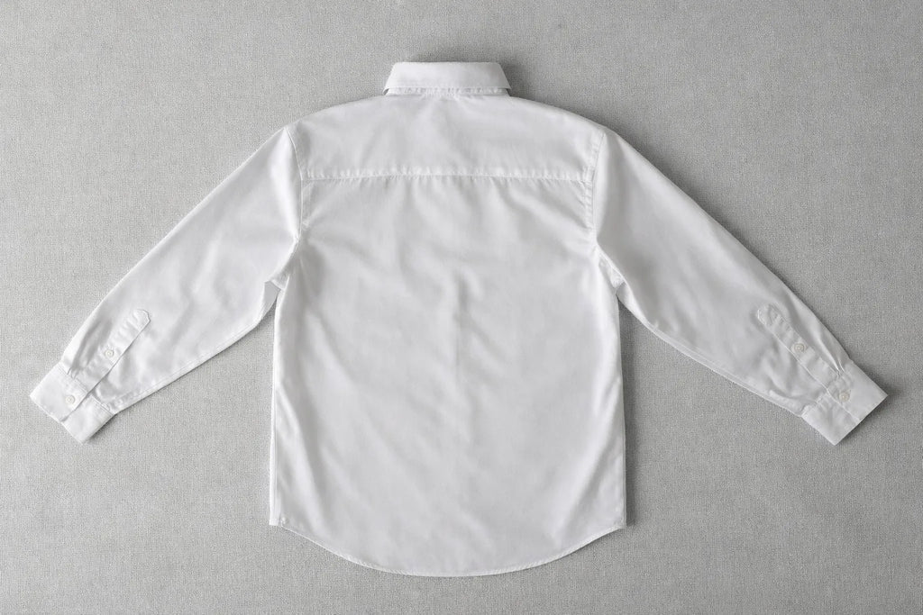 Close-up of textured fabric Puzzle Shirt showcasing handcrafted artisanal detailing and organic textile work