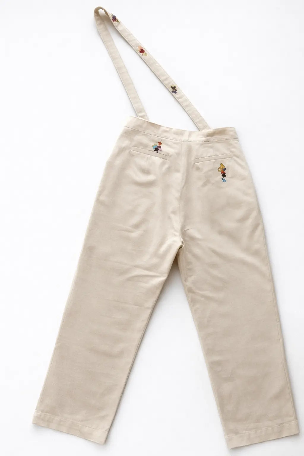 Model wearing artisanal Puzzle Slacks slow fashion clothing with experimental design Tumulto