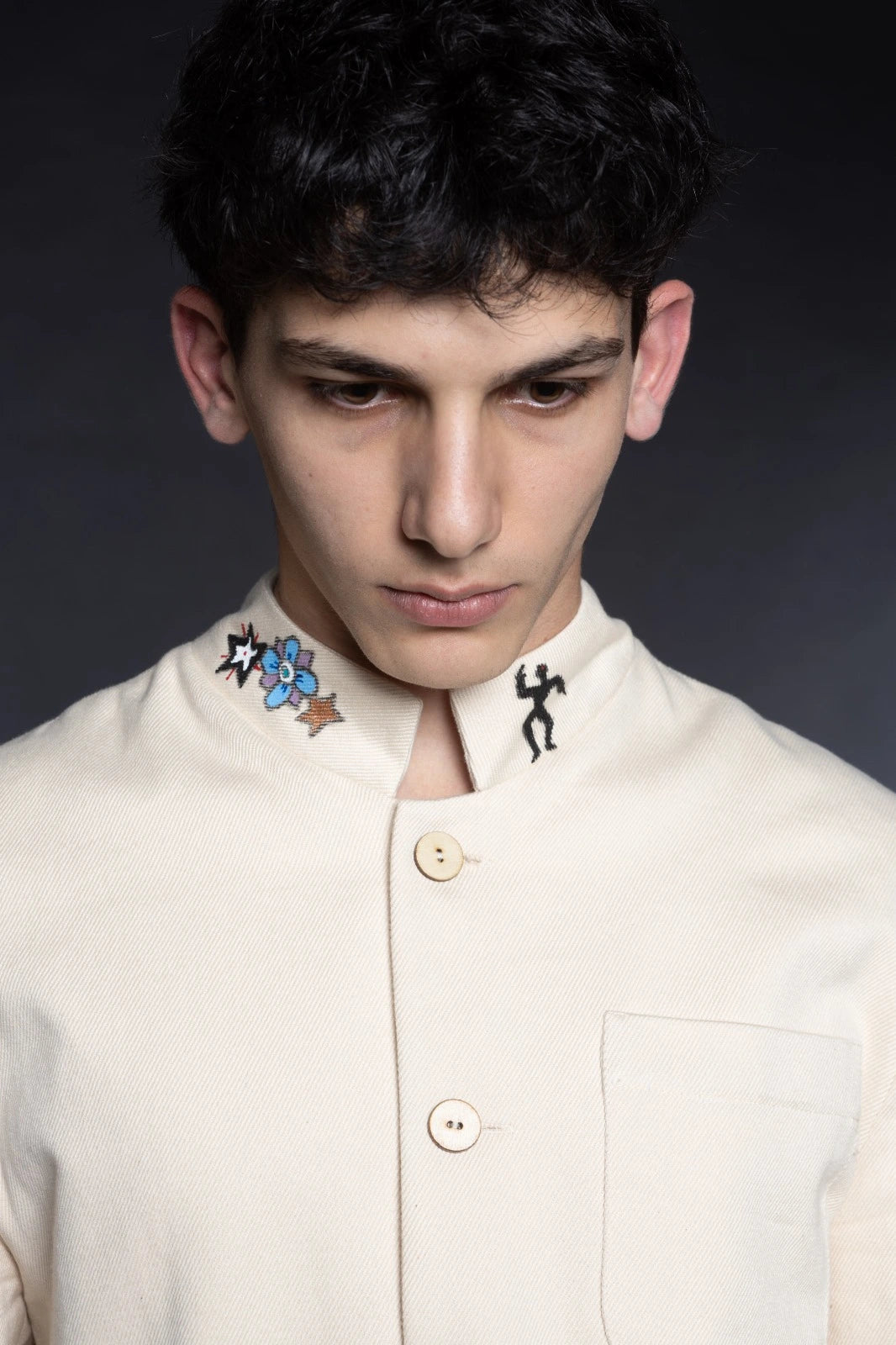Close-up of textured fabric artisanal blazer sustainable fashion design Tumulto